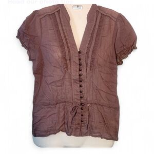 Purple blouse with a tie in the front working buttons and ruffle sleeves